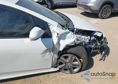 2021 Toyota Prius Xle z USA, uszkodzony, nr VIN JTDKAMFU9M3130578